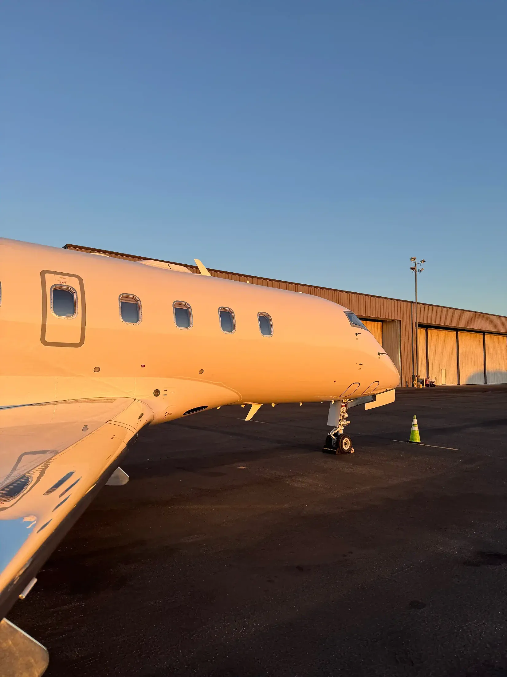Business jet at sunset after a waterless exterior dry wash